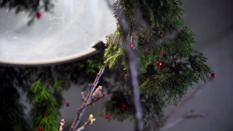 Close-Up-of-Indoor-Christmas-Decorations-Featuring-Wood-Accents-and-Festive-Trees