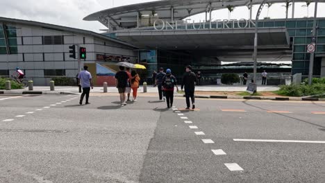 group of people crossing a city street.