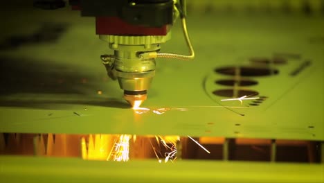 CNC-Laser-cutting-of-metal-in-slow-motion,-modern-industrial-technology.