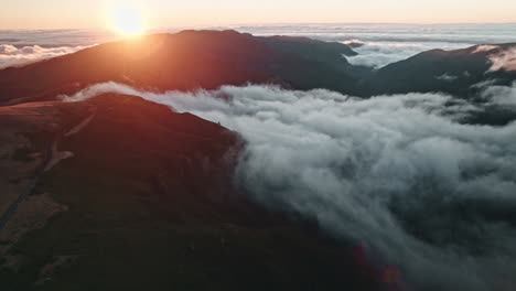 madeira sunset above clouds, panoramic view, mountains and valley, droneshot aerial