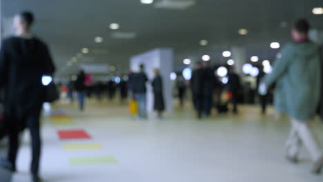 blurred view of a crowded exhibition hall