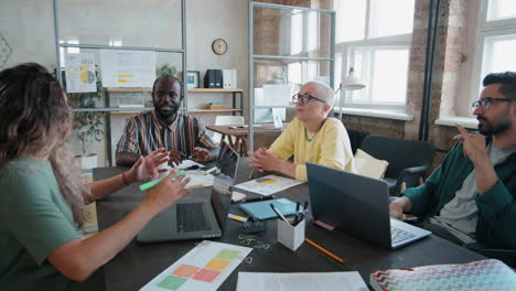diverse colleagues and man in wheelchair having business meeting