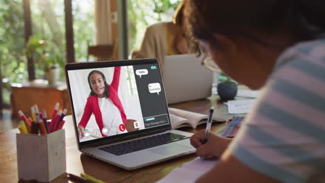 composite video of girl using laptop for online lesson at home, with girl raising hand on screen