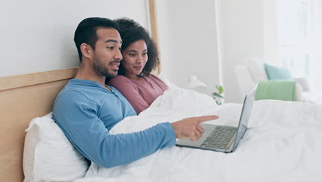 Happy,-love-and-couple-in-a-bed-with-laptop