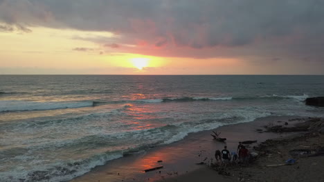 Volunteers-on-Pererenan-Beach,-Bali-for-sunrise-beach-clean-event