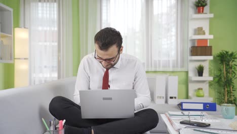 Portrait-of-young-businessman-working-from-home.