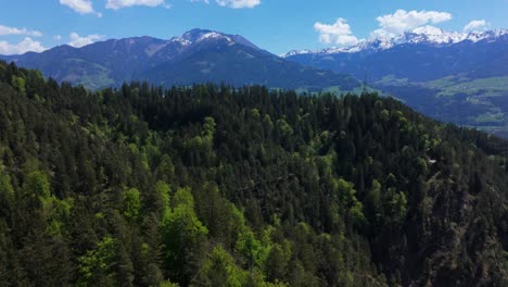 small town in the alps drone flight with blue sky in summer