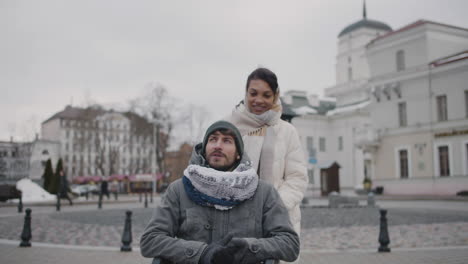 Muslim-Woman-Taking-Her-Disabled-Friend-In-Wheelchair-On-A-Walk-Around-The-City-In-Winter-2