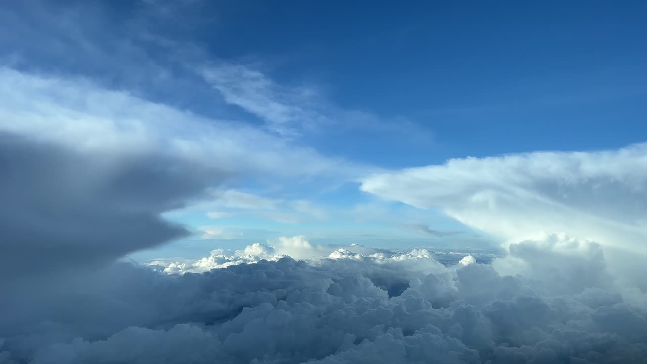An unique pilot&rsquo;s point of view while flying between menacing storm clouds, at 12000m high, with a deep blue sky