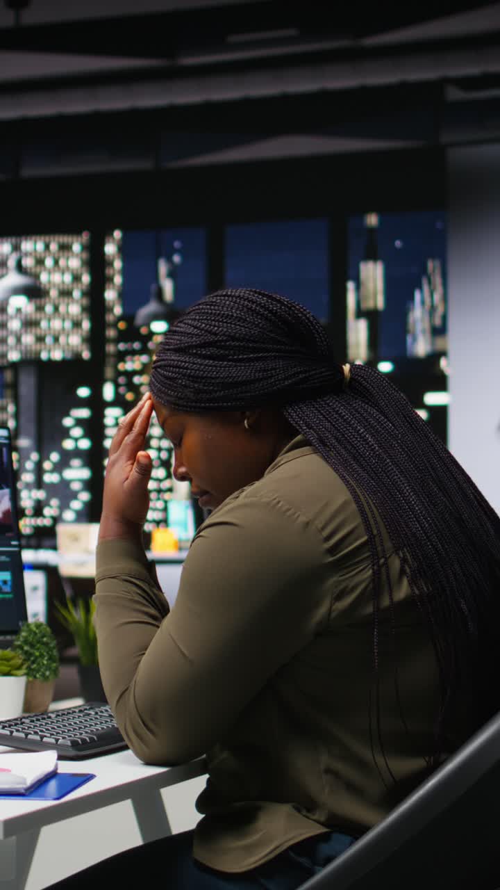 Vertical Video Fatigued drained videographer works on film montage with migraine