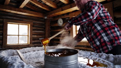 making traditional maple taffy on snow in a sugar shack