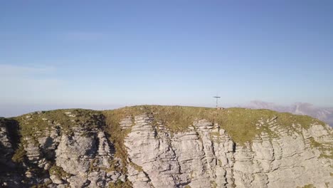 Drone-shot-of-a-summit-cross-on-the-mountain-Leistchamm-in-Switzerland