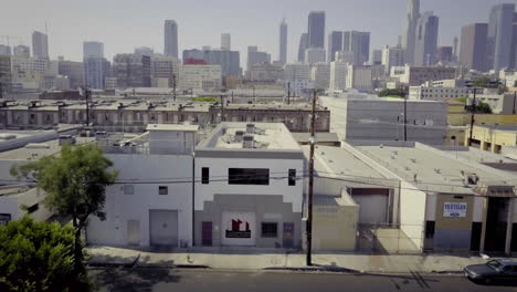 aerial view of los angeles downtown industrial district with city skyline