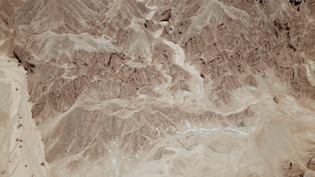 Experience the breathtaking beauty of Atacama's rock formations like never before with stunning drone footage showcasing the desert's rugged terrain from above