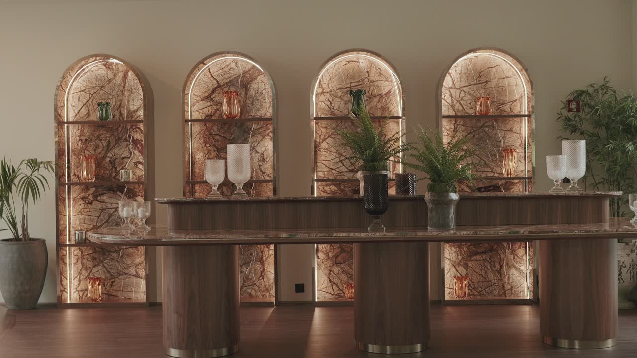 refined space with lit marble niches and polished contemporary bar