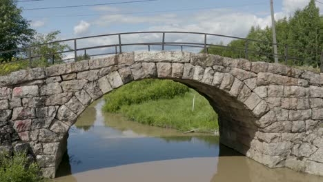 still aerial view of an old stone bridge in finland near kerava