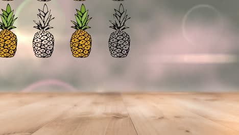 animación de piñas que se mueven sobre el suelo de madera contra el efecto bokeh y los puntos brillantes