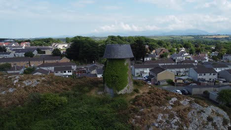 melin wynt y craig llangefni ivy covered hillside windmill landmark aerial view overlooking welsh snowdonia mountains, anglesey