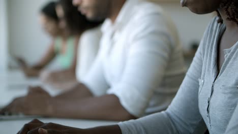 closeup shot of focused young woman using laptop