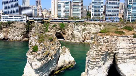 Pigeons-Rock-With-Waterfront-High-rise-Buildings-In-Background-In-Beirut,-Lebanon