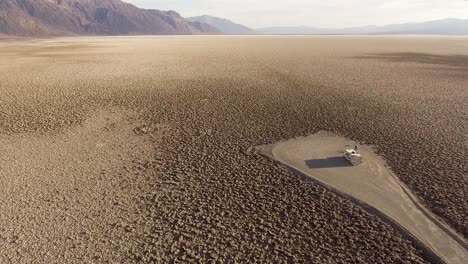 a crater landscape in california in the front is a rv