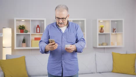 The-old-man-looking-at-the-high-bill-gets-angry-with-the-people-on-the-phone.