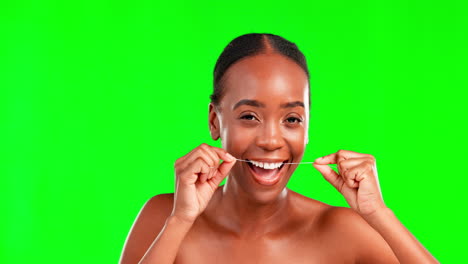 Face,-dental-floss-and-woman-against-green-screen