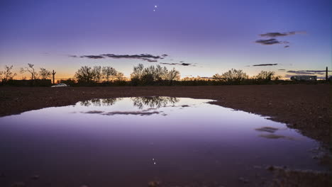 time lapse of the conjunction of jupiter and venus as the descend and reflect off a pond