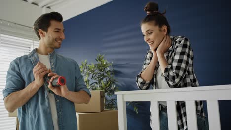 video of couple turning the bed in a new home.