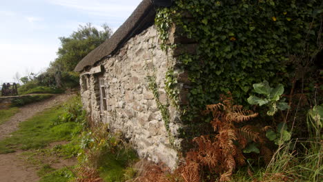 close-up-shot-looking-up-at-old-fisherman's-cottage-at-Bessy's-Cove,-The-Enys,-cornwall