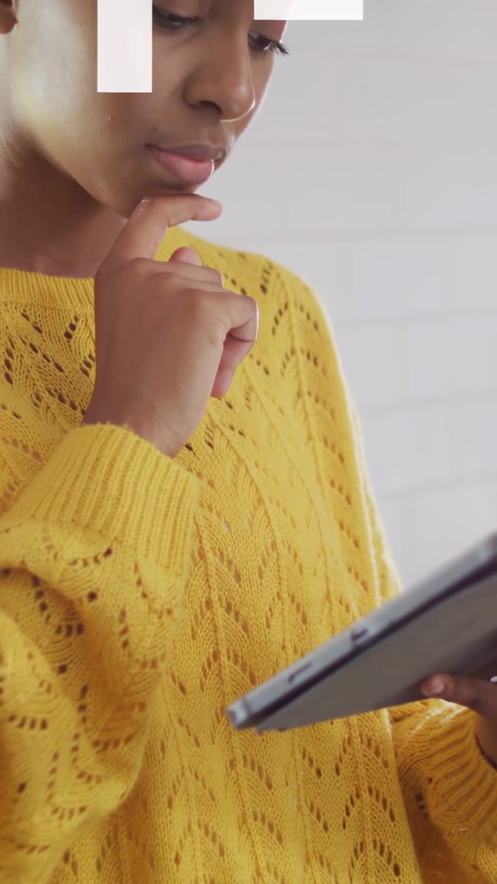 Vertical video: Camera panning revealing tablet, woman tapping, swiping, arrows guiding tech read