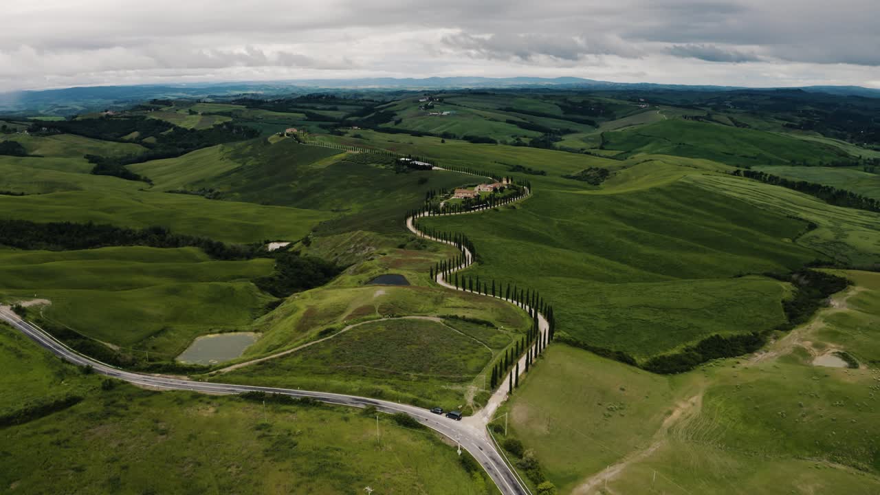 Aerial view of roads passing through Tuscany's vast farmland