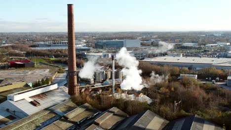 pilkington glass factory warehouse buildings aerial circling view across industrial town skyline