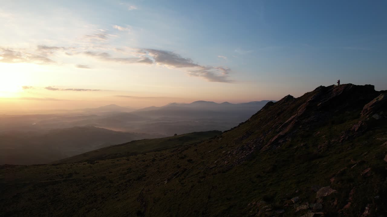 Aerial view from a drone at sunrise over the French Pyrenees, capturing the majesty of La Rhune. Soft light and misty mountains for an exceptional natural panorama.
