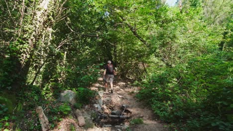 hiking up a gradual incline along the catalonian trails near river riells