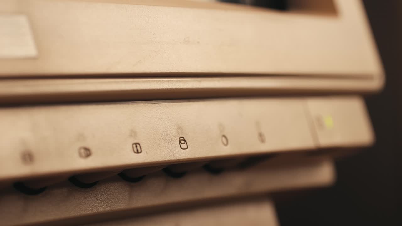 Man working and gaming on retro computer PC, IT engineer with vintage computer at home, using old fashion technology, close up of retro setup.