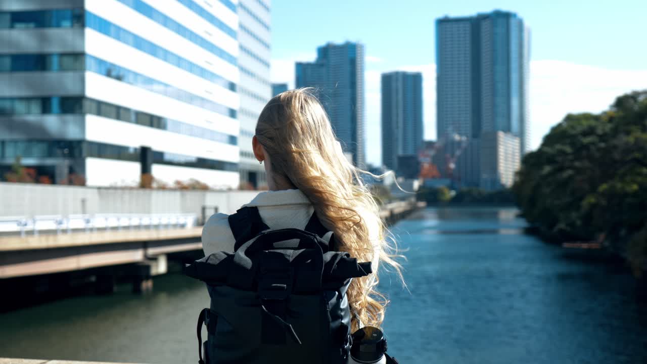 A serene shot of a photographer immersed in capturing the beauty of Hamarikyu Gardens in Tokyo.