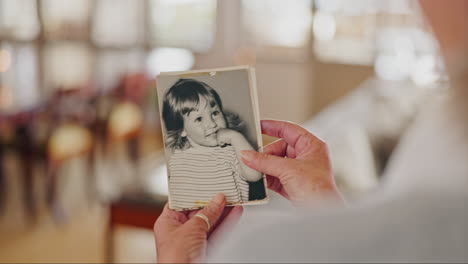 memory, photo and zoom on hands of senior woman