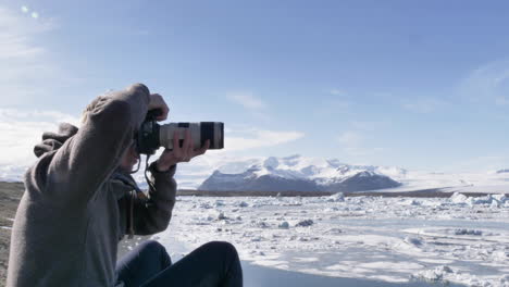 Young-Traveler-Taking-Picture-of-beautiful-Glacial-Lagoon