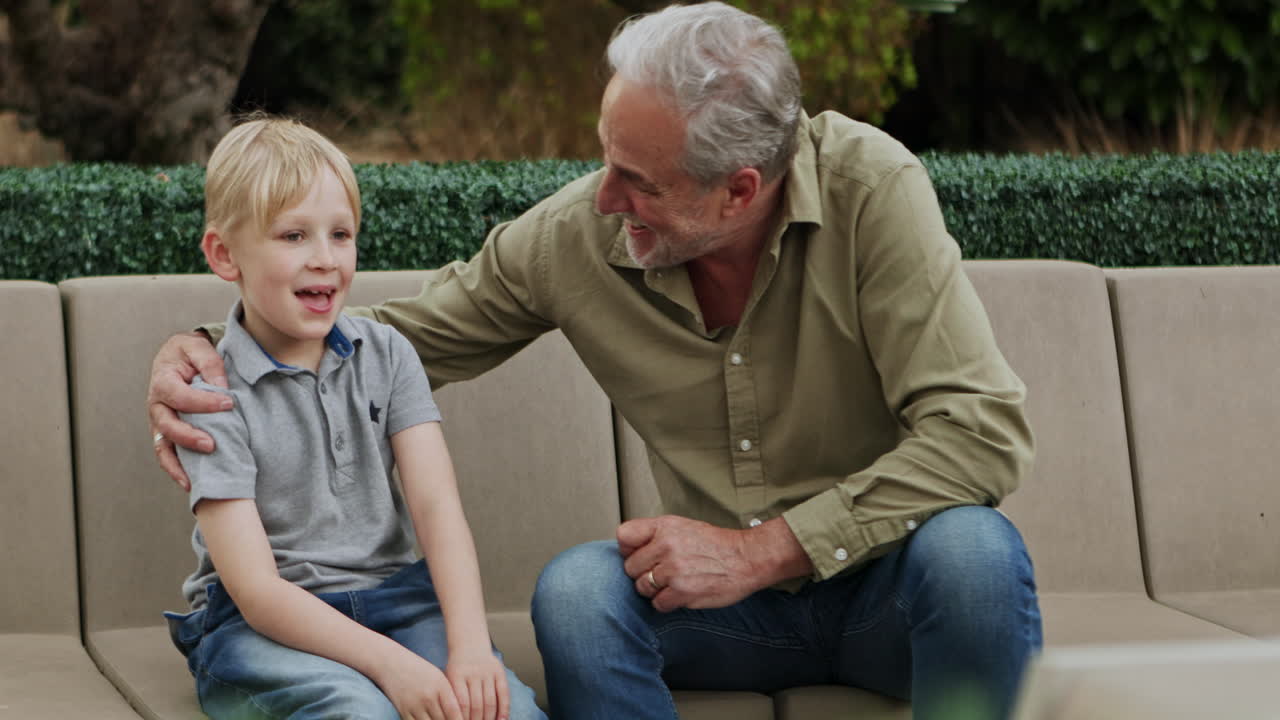 Grandfather and grandson spending time together outdoors