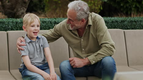 grandfather and grandson spending time together outdoors