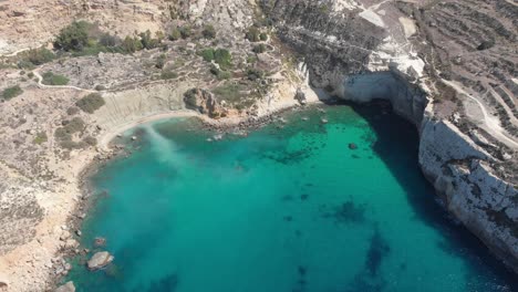 Aerial-drone-video-from-western-Malta,-Mgarr-area,-Fomm-ir-Rih-bay