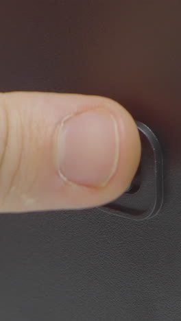 finger pressing a button