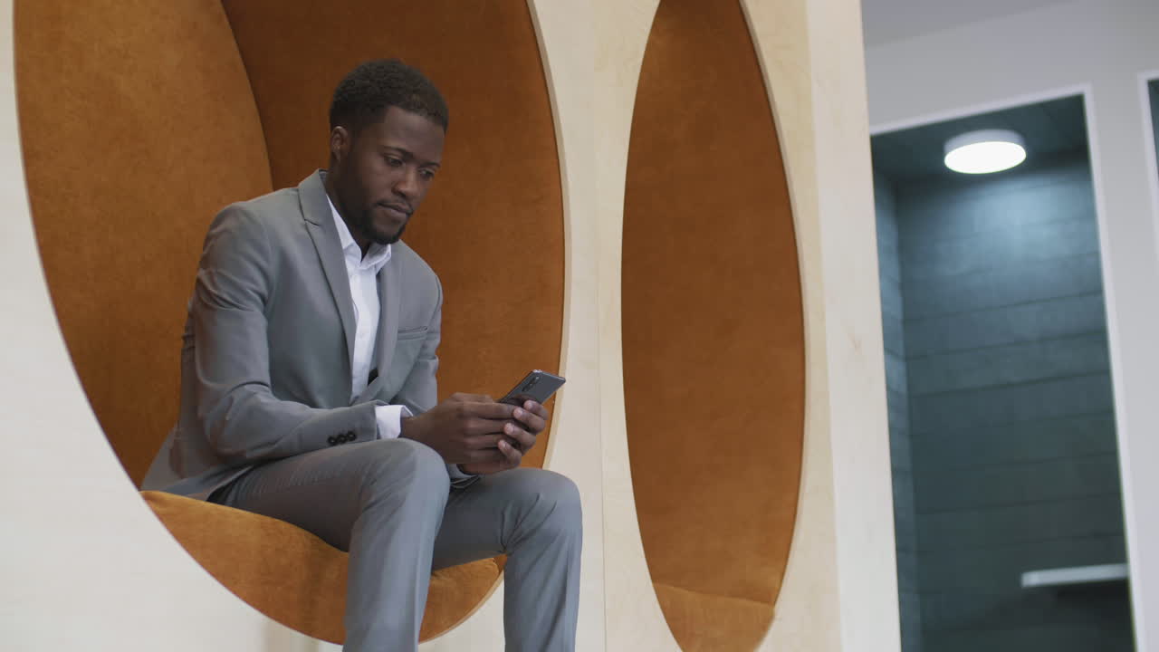 African-American Businessman Using Mobile Phone