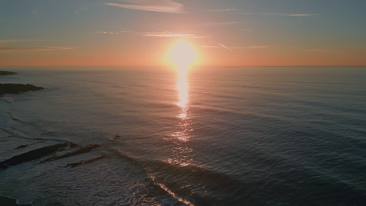 Morning marine tide splashing slow motion. Aerial view calm sea waves at sunrise