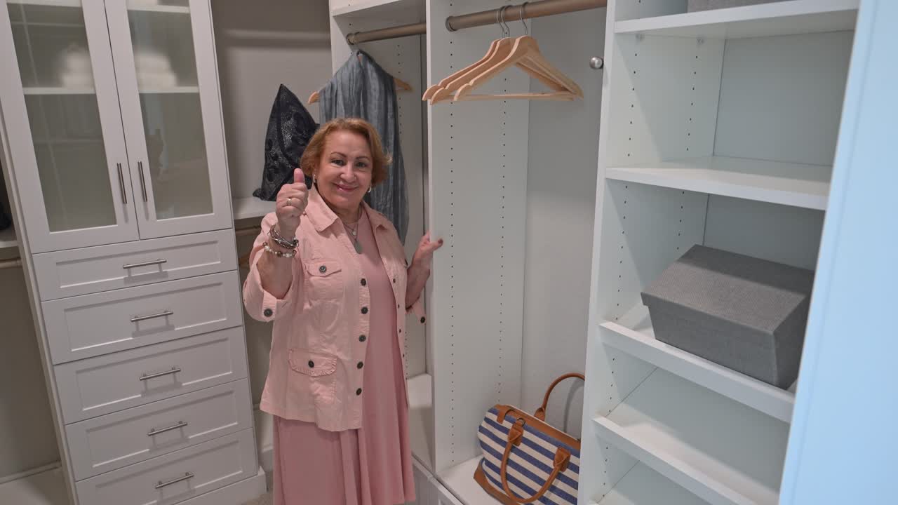 happy customer signals she is very happy with the new modular custom closet organization installation