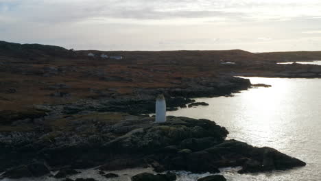 aerial orbiting shot of the white lady mystery daytime maritime marker in clifden bay