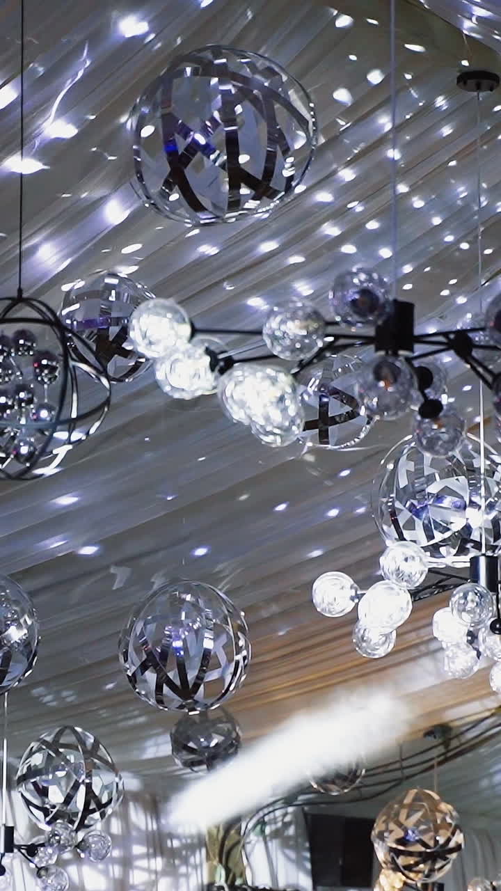 Rotating sparkling disco ball. Mirror disco ball reflecting lights background