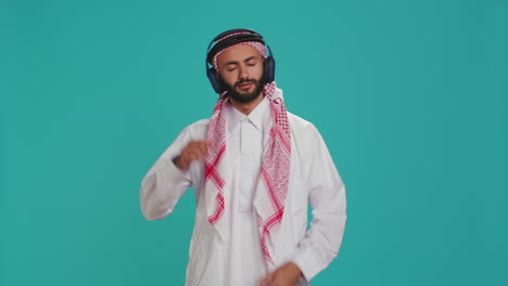 joyful person dancing on songs in studio