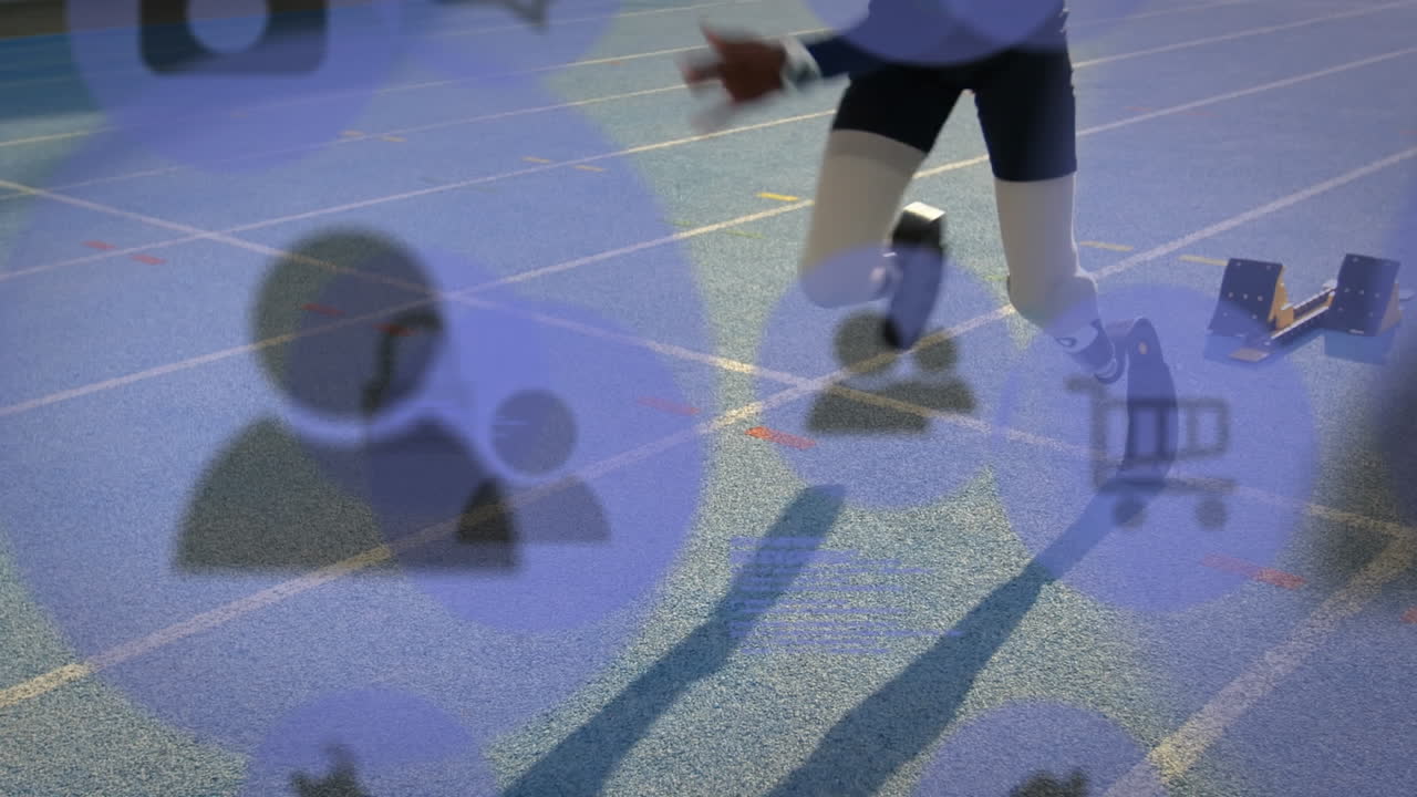 아이콘의 애니메이션은 달리기 트랙에서 인공 다리로 달리는 두 인종의 운동 선수를 비활성화합니다.